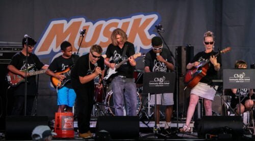 Photo of CMS Modern Band students performing at Musikfest group music classes