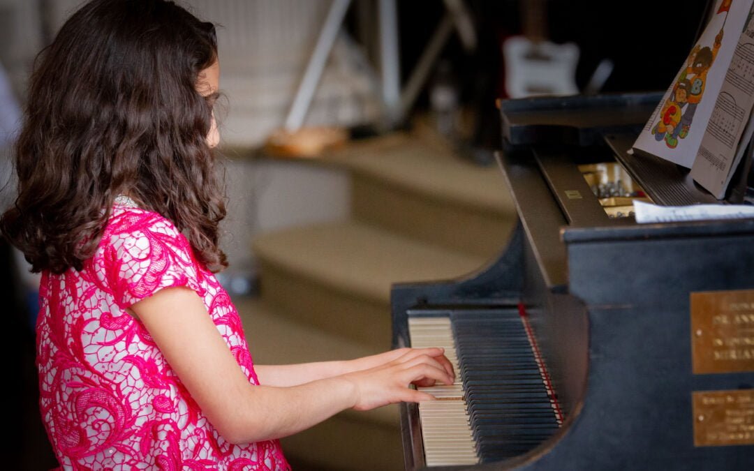 Girl playing the Piano at CMSLV's Spring Student Recital