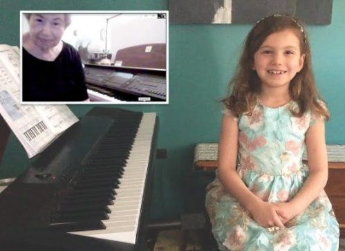 Carole Houghton teaching online lesson to female minor student both sitting at piano