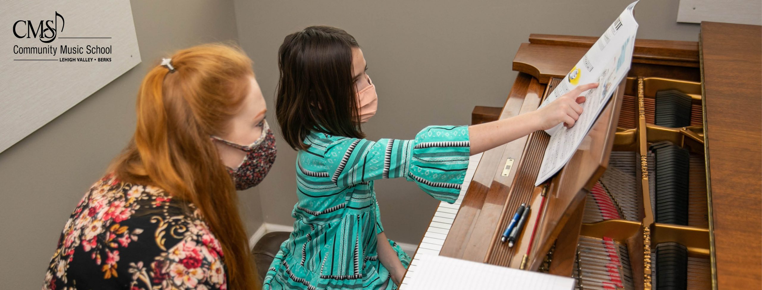 Dr. Annie Tindall-Gibson gives a piano lesson to a young girl at Community Music School.