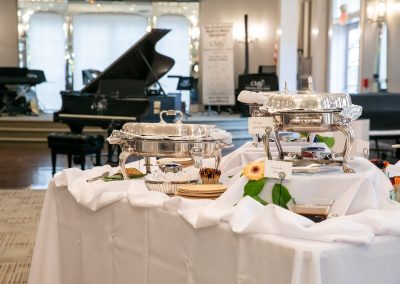 an elegant buffet meal for an event rental set up at community music school