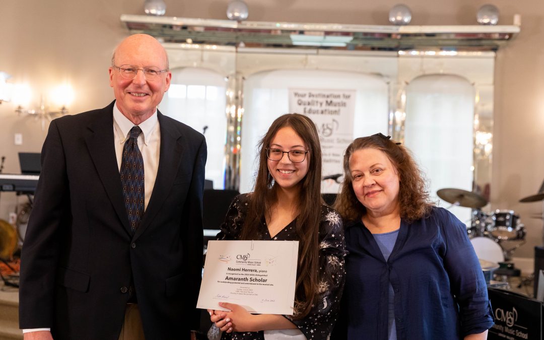 Naomi Herrera (center) was also recognized as the 2023-24 Amaranth Scholar for her outstanding dedication to her studies in piano, violin, and voice, here at CMS. Also pictured are Executive Director Jeff Reed (left), and Naomi’s piano teacher, Kathy Anthony (right). The Amaranth Foundation Scholarship is awarded to a CMS student who demonstrates a high potential for achieving excellence in music education and whose family has documented financial need. The Amaranth Foundation was founded by Joan Miller Moran and supports arts-related programming and organizations, including Community Music School.