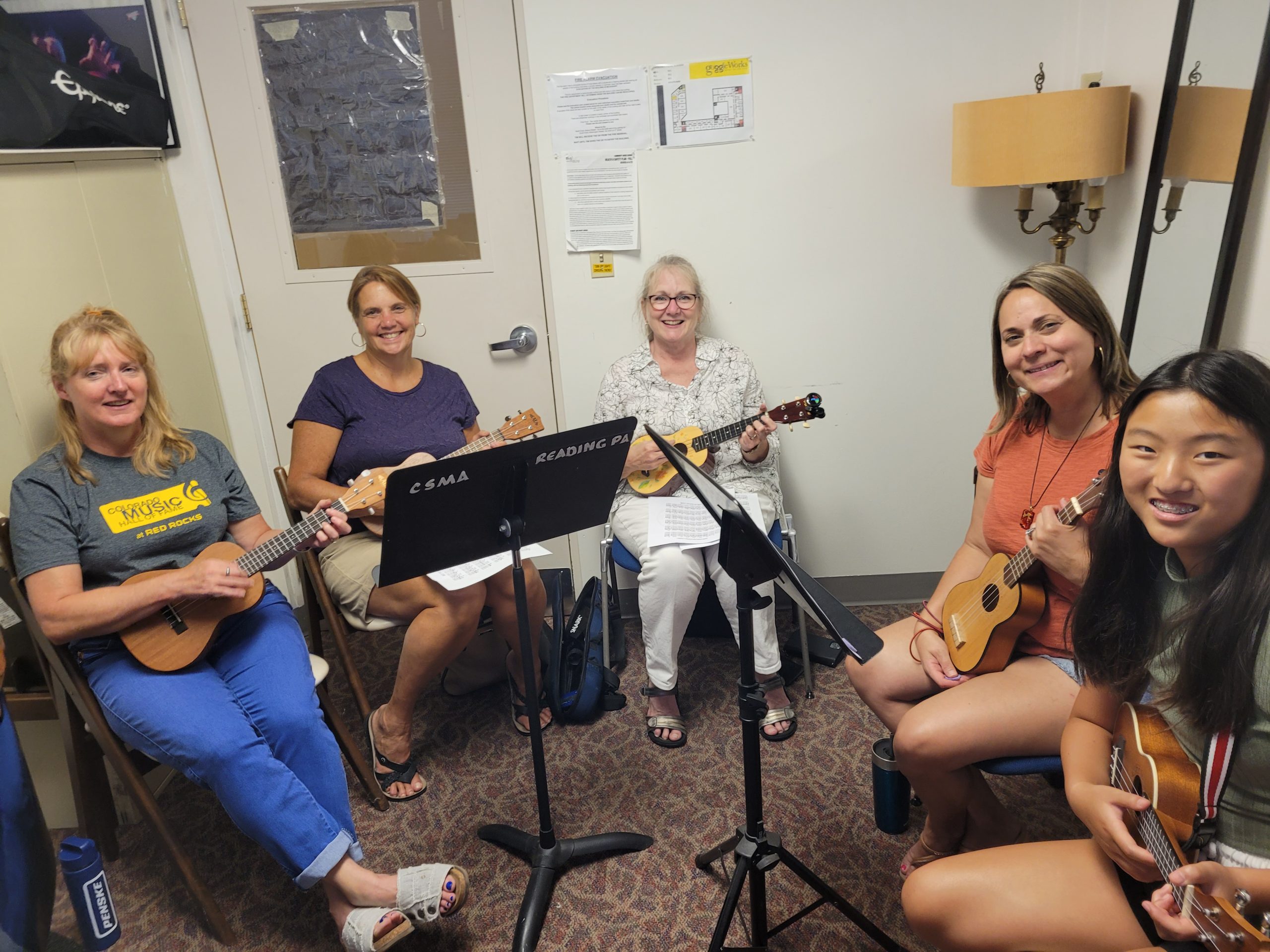 Intro to Ukulele Workshop Summer session at CMS Berks with Mikaela Krall - five women holding ukuleles and smiling