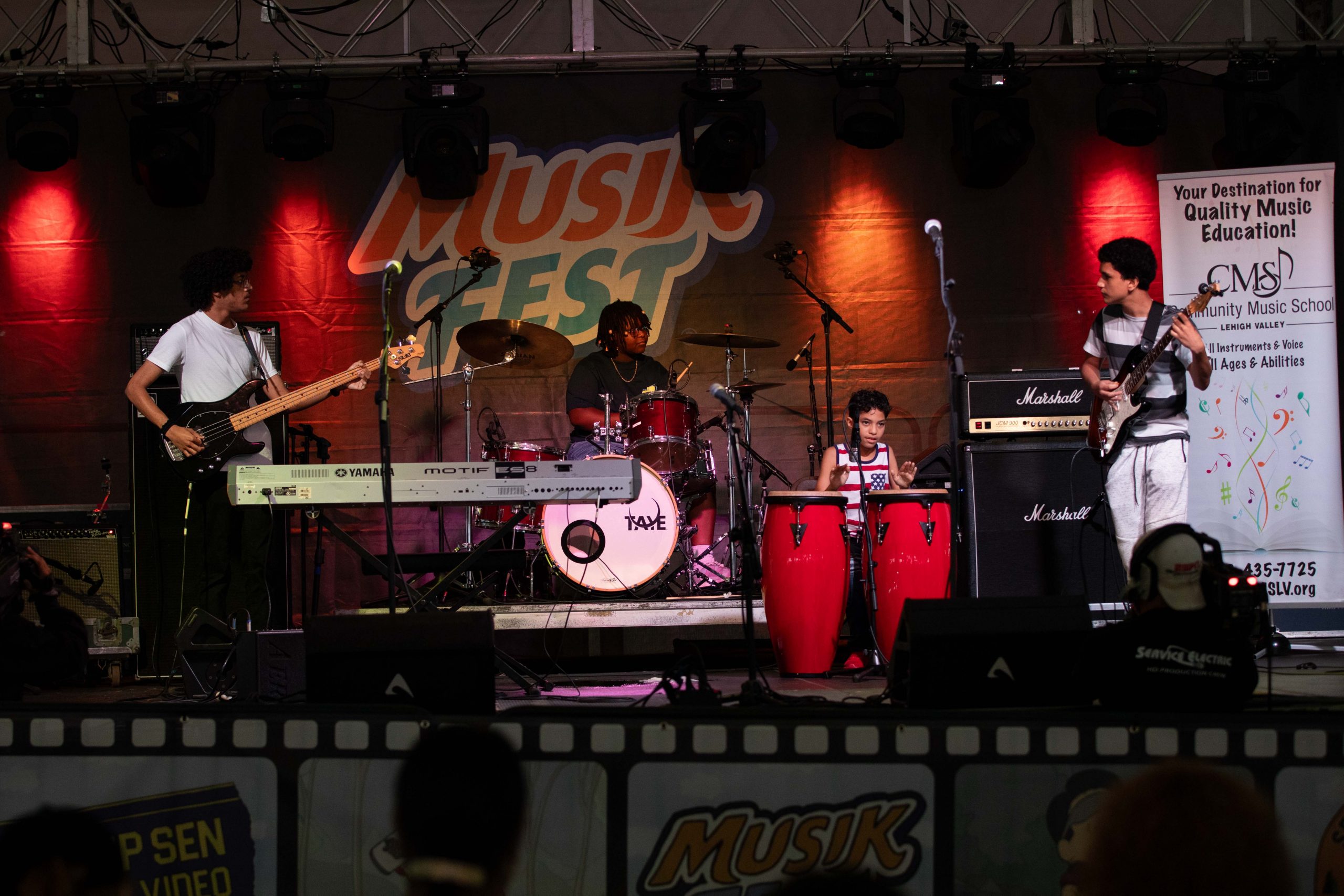 Community Music School House Band performs on the Musikfest Plaza Tropical Stage in August 2023